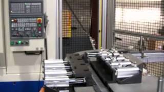 Fanuc M16iB Robot Loads a Pair of Okuma VMCs [upl. by Huebner74]