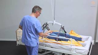 Guldmann Sling Instruction Repositioning sling  Moving patient in bed [upl. by Ycul]