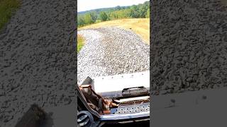 Leveling 2 Inch Rock for New Gravel Driveway construction drivewayprofessionals gravelroad [upl. by Enortna]