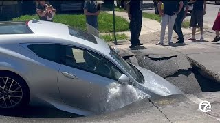 Car falls into sinkhole as street collapses in Southwest Detroit [upl. by Assirrak]