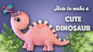 CAKE NATION  How To Make a Cute Fondant Dinosaur Cake Topper [upl. by Arev32]