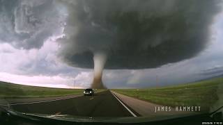 Storm chasing dashcam Tornado crossing the highway Laramie Wyoming [upl. by Nonad]