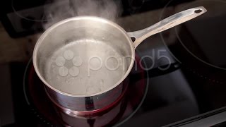 A Pot Of Boiling Water On The Stove Rapid Boil With Steam Stock Footage [upl. by Maxima932]