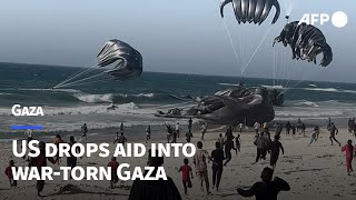 US drops aid into wartorn Gaza  AFP [upl. by Adalia398]