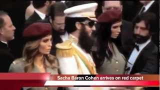 Oscars 2012 footage Sacha Baron Cohen tips ashes over Ryan Seacrest [upl. by Sulohcin654]