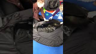 Folding down a Sensory Direct pop up dark play tent [upl. by Yttam]