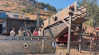 A local mechanic is making a new vibrating screen for a crushing plant from old iron sheets [upl. by Clava]