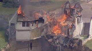 Burning down the house Texas family burn down luxury home that hangs over 75ft cliff [upl. by Peer183]