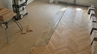 Putting down herringbone flooring [upl. by Annoya]