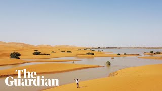 Drone footage shows rare flooding in the Sahara desert [upl. by Erlene]