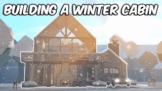 BUILDING A SNOWY WINTER CABIN IN BLOXBURG [upl. by Drareg336]