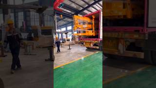 How to transport a spider lift by a containerTowable boom liftscherry pickers loading and fixing [upl. by Freeborn]