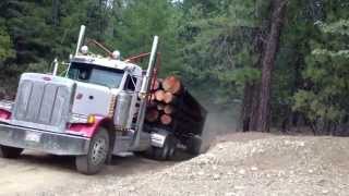 Two log trucks coming over a hill [upl. by Ree]