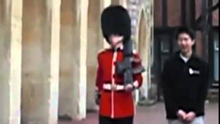 The moment a Queens Guard soldier lost it and drew his gun at annoying tourist [upl. by Ydollem]