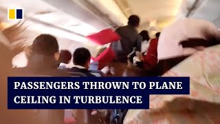 Passengers in China thrown to plane ceiling in turbulence [upl. by Tenrag524]