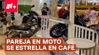 Pareja en motocicleta se estrella en café  N Shorts [upl. by Tichon]