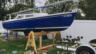 Lifting a boat off a trailer and stripping bottom paint [upl. by Kcirdderf819]