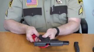 Gun lock demonstration  handgun [upl. by Nairadal]