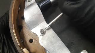 Technique to remove parking brake lever horseshoe clip from brake shoe [upl. by Hollyanne735]