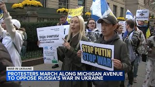 Protesters march in Chicago to oppose Russian President Putins war in Ukraine in global effort [upl. by Lusty]