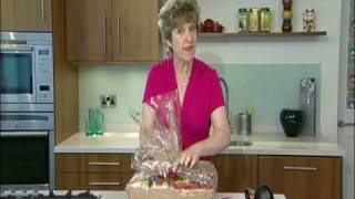 Wrapping a hamper using cellophane wrap [upl. by Zeb]