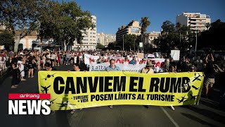 Thousands protest against mass tourism in Spain [upl. by Aleacim807]