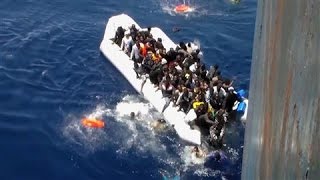 Migrants Flee Sinking Dinghy in Dramatic Footage [upl. by Nerred857]