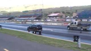 drag race lifted ford excursion diesel vs ford f350 steak bed black smoke and burnout [upl. by Etirugram]