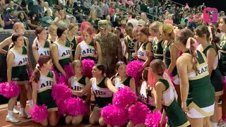 Military Dad Surprises Cheerleader Daughter By Photobombing Group Photo [upl. by Akirrehs]