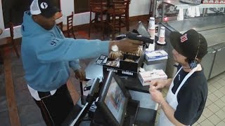 Watch Unfazed Cashier Keep His Cool During Terrifying Gunpoint Robbery [upl. by Acinorev]