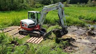 Excavator work  dredging at Boyette Gin Pond Using mud mats to access the old Bostick Mill Creek [upl. by Dougherty717]