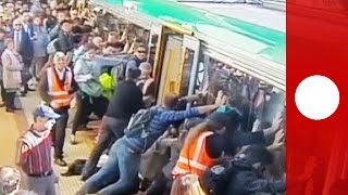 People power passengers free man trapped by train in Australia [upl. by Perlis740]