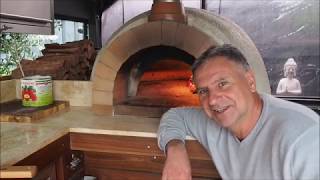 How to Use a Wood Fired Pizza Oven [upl. by Anifares108]