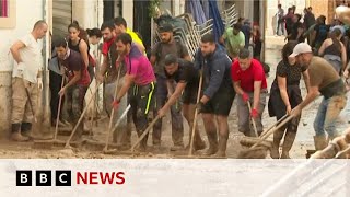 Thousands of volunteers help with clean up in floodhit Valencia  BBC News [upl. by Weisler]