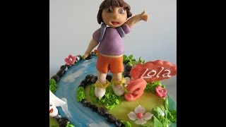 Fondant Cake Decorating  How to make Dora the Explorer [upl. by Ellek567]