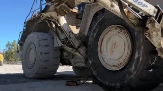 Changing a tire on a CAT 988 wheel loader tire otrtire heavyequipment [upl. by Shelley]