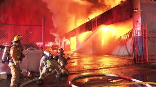 Canoga Park CA Greater alarm fire rips through a row of commercial businesses around 2am [upl. by Natal310]