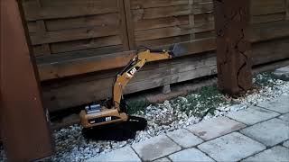 Huina 580  Caterpillar 330D RC excavator  test digging [upl. by Elletnuahc]