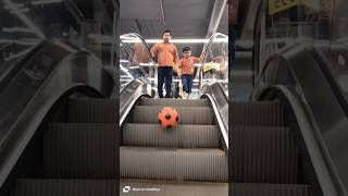 The funniest little boy wants to catch the Football on the escalator shorts viral [upl. by Asselam]