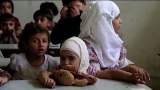 La guerra di Siria Aleppo il ritorno a scuola si fa in cantina [upl. by Nelehyram119]