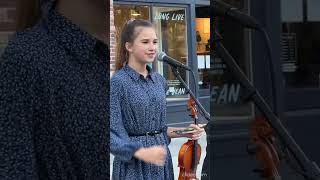 Karolina Protsenko talks to the crowd before playing violin cover [upl. by Coben]