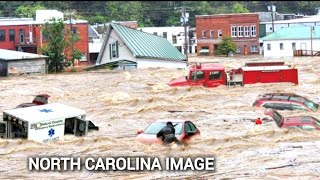 North Carolina home and trucks swept away by flash floods in Asheville [upl. by Saisoj585]