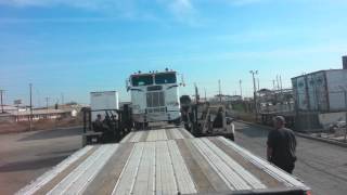 loading truck onto step deck trailer with forklifts [upl. by Ecyaj]