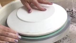 Using the pottery wheel to throw dinner plates on plaster forms [upl. by Pinebrook118]