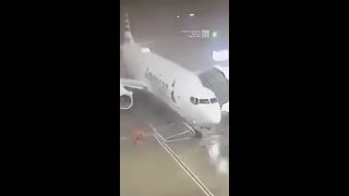 Winds Whip Plane Away From Gate At Dallas Fort Worth Airport [upl. by Adolph684]