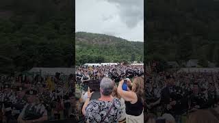 Raising the Standard of the Ballater Highland games and The pipe bands [upl. by Peedus187]