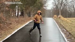 Boy ice skates down frozen street in galoshes [upl. by Laroc]