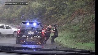 Virginia policeman saves fellow officer from oncoming car [upl. by Peggy921]