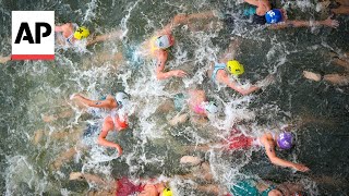 Triathlon kicks off on Day 5 at Paris Olympics  AP Top Photos [upl. by Vinia]