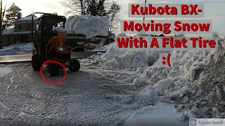 Kubota moving snow with a flat tire  Fixing it Tire off the rim [upl. by Vins260]